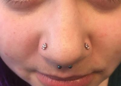 image of a nose piercing done by Kacee Bateman