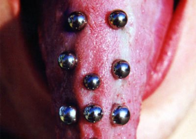 image of tongue piercings done by Monte Vogel at Skin Deep
