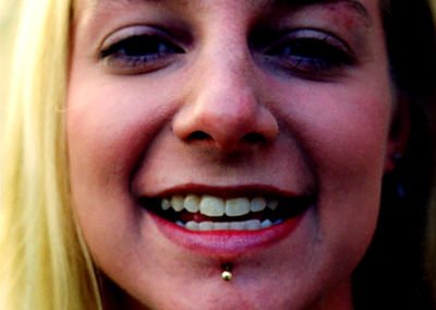 image of a woman with piercing in chin done by Monte