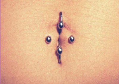 image of belly button piercings done by Monte Vogel at Skin Deep