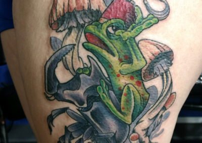 image of a toad and mushroom tattoo done by Mike Welch of Skin Deep